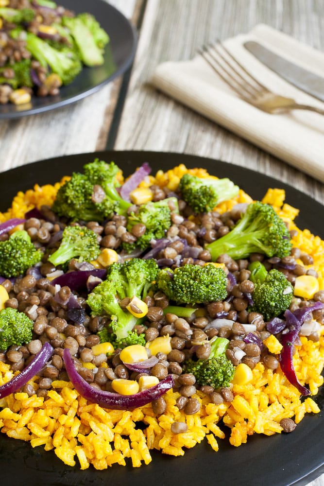 Close-up of broccoli lentil stir fry served with turmeric rice