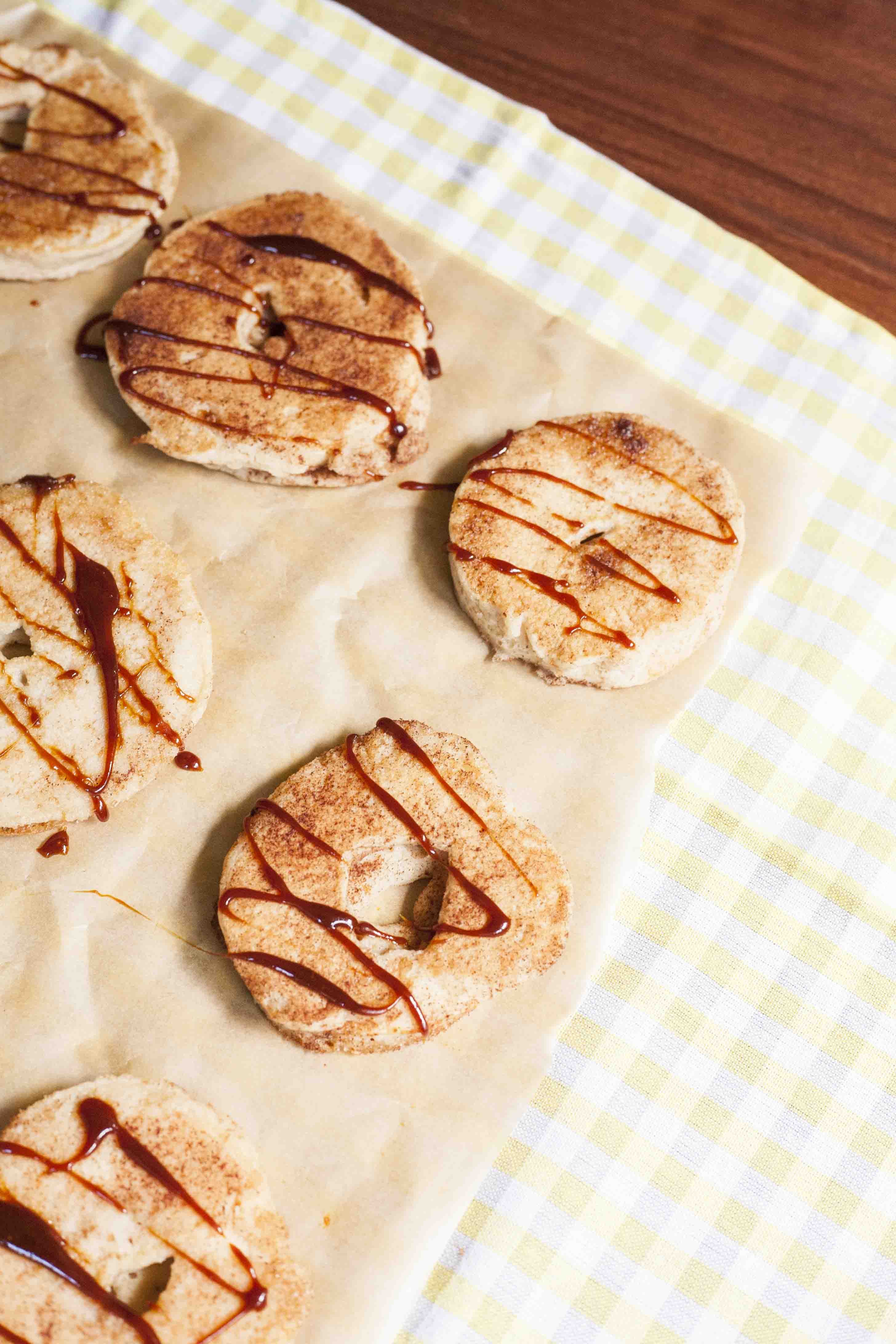 Close-up of fried battered apple rings with caramel sauce. 
