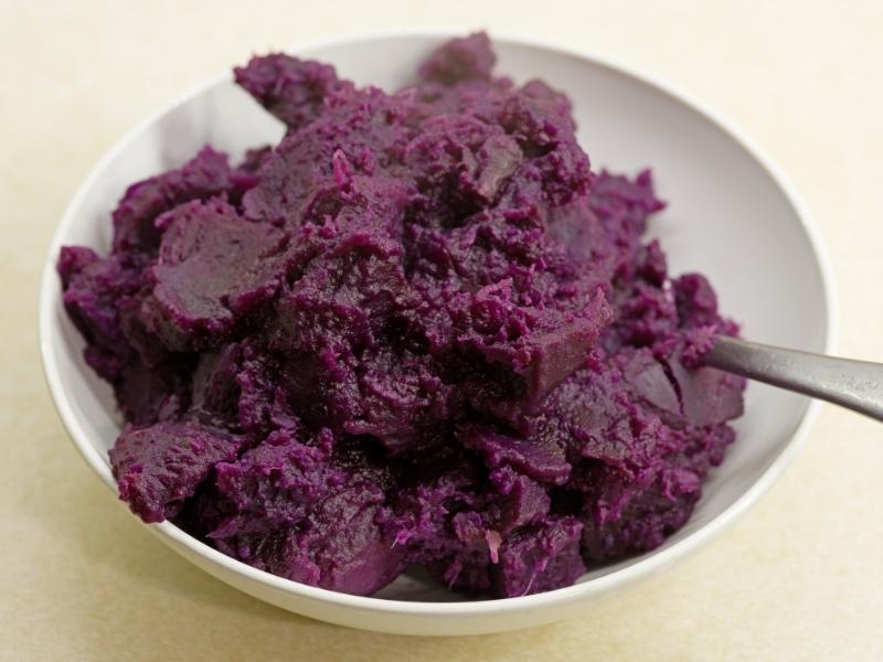 Purple puree in small white bowl