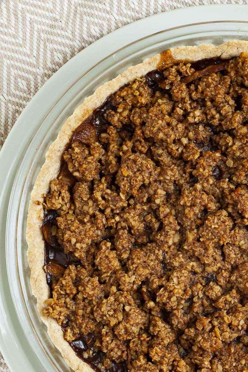 Apple Crisp Pie from above on a large white plate showing the brown crisps on the top