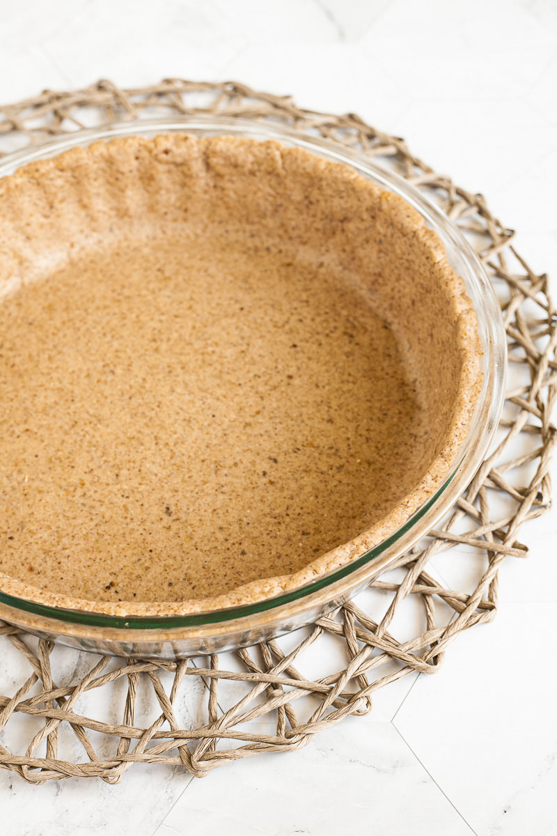 Cake form from above showing the rolled out gingerbread pie crust dough