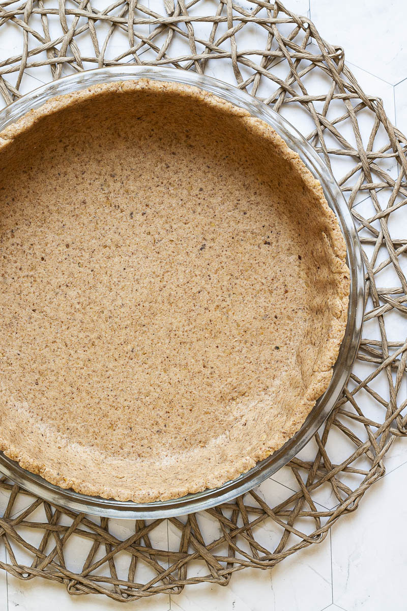 Cake form from above showing the rolled out gingerbread pie crust dough