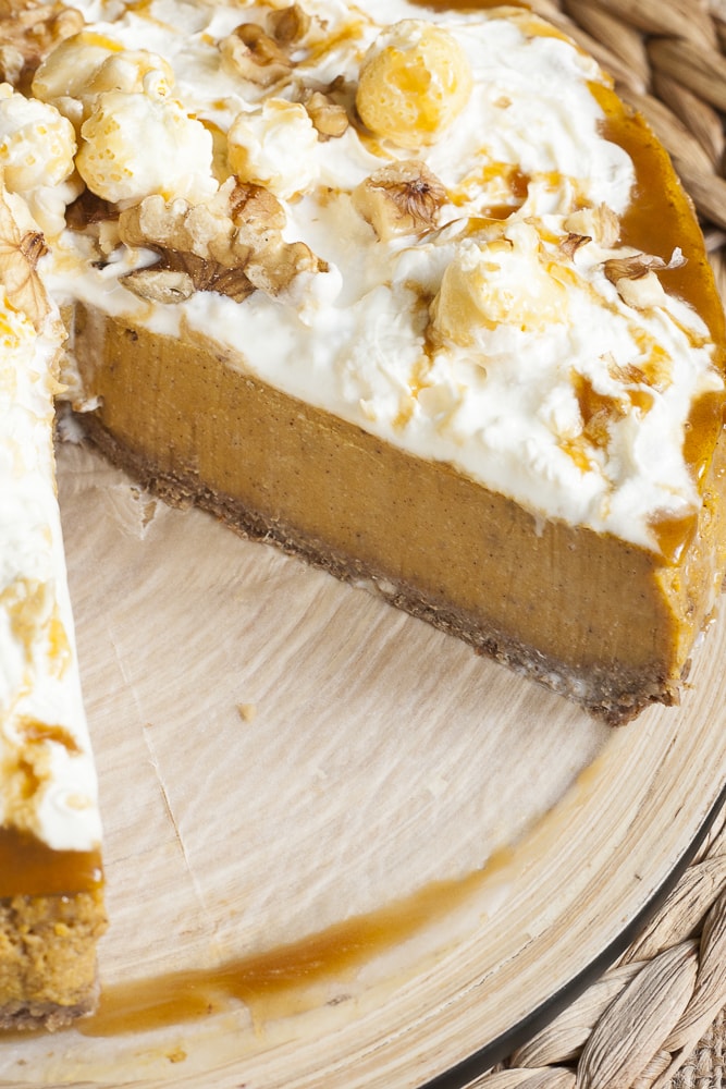Pumpkin cheesecake with gingerbread pie crust sliced so you can see how the dough looks like in action
