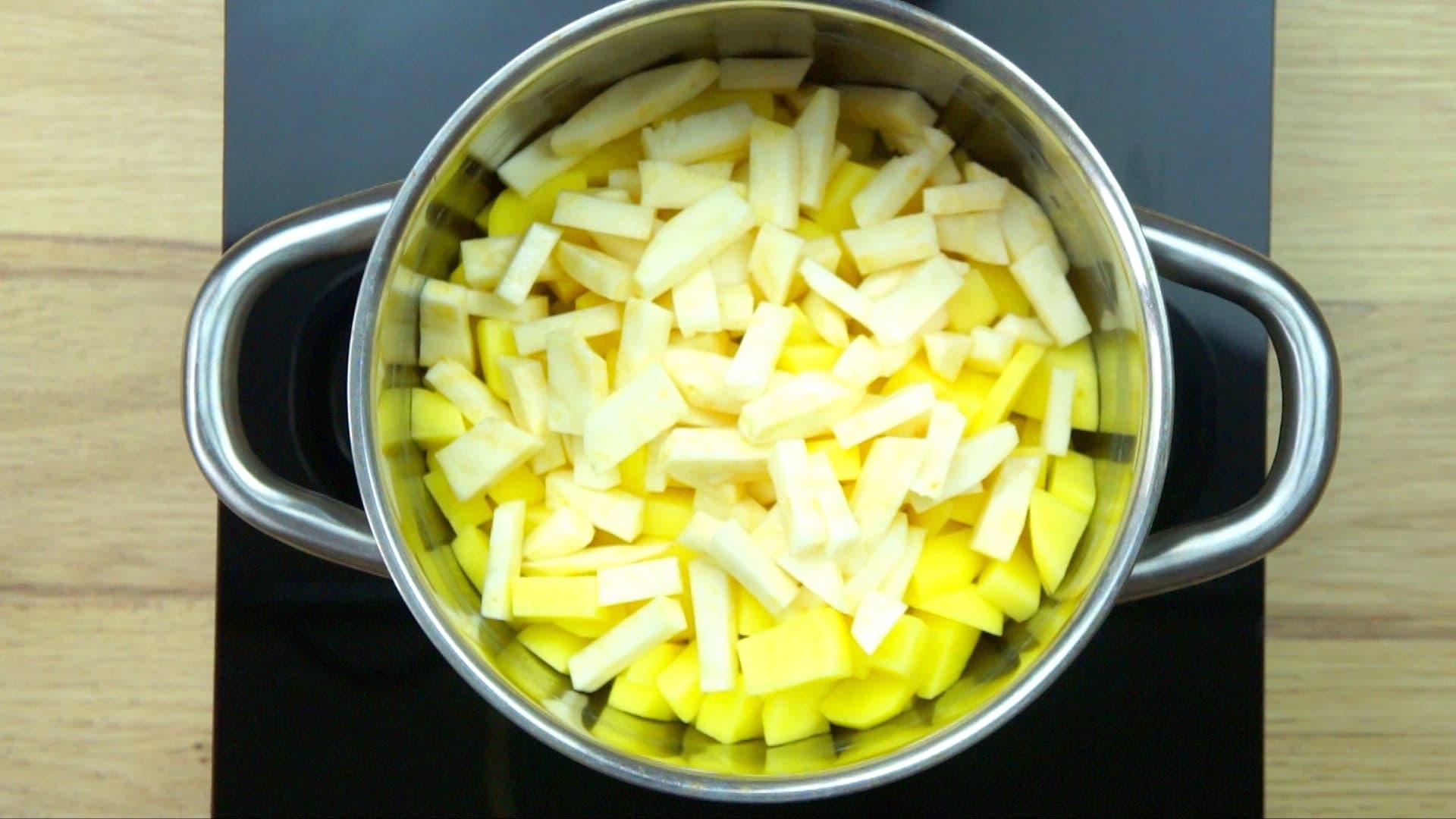 Stockpot with diced potatoes.
