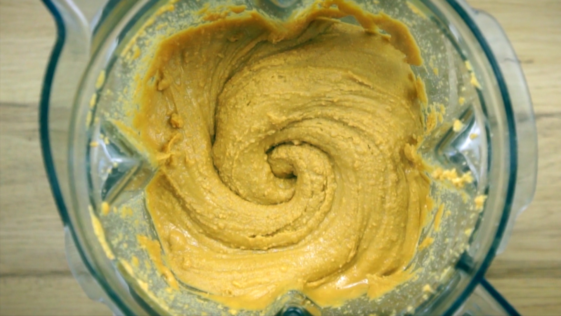 Blender from above with a crunchy brown homemade peanut butter