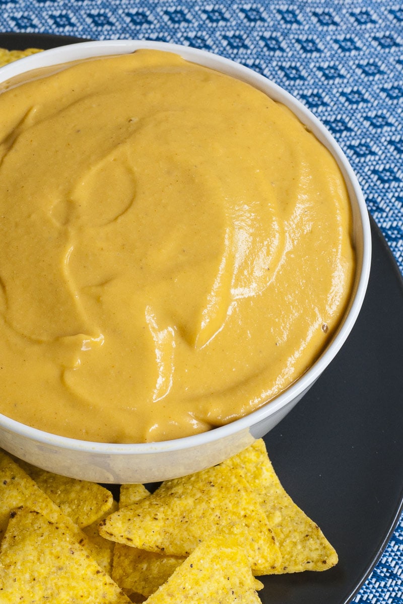 White bowl of nut-free nacho cheese dip 