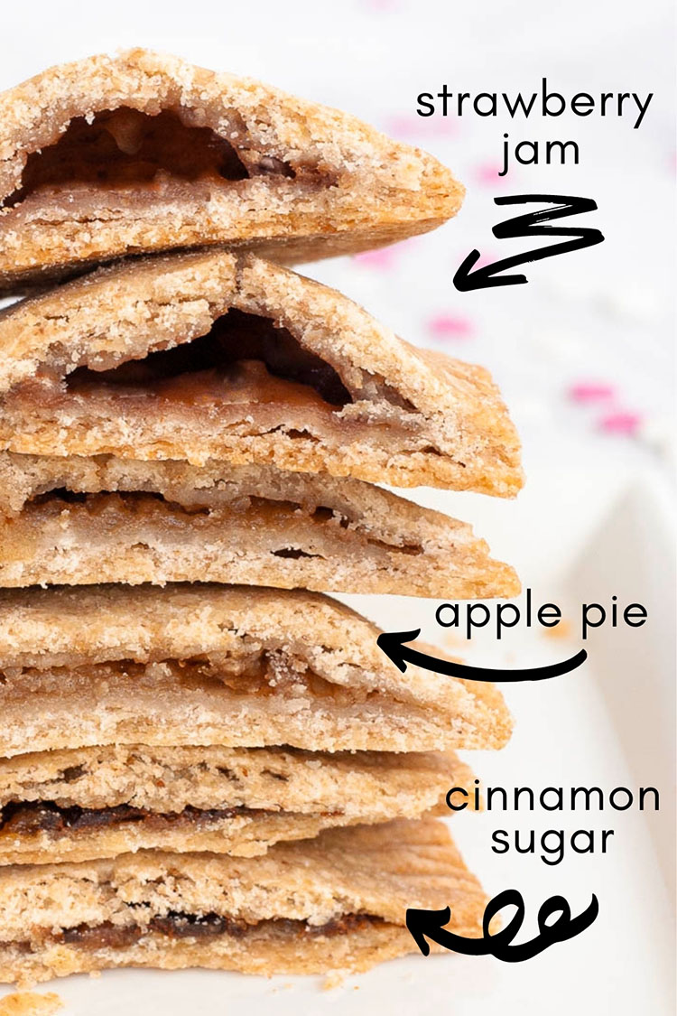 A stack of pop tarts, rectangle-shaped pillow-like cookies cut in the middle so the inside is visible which is alternating dark purple and brown