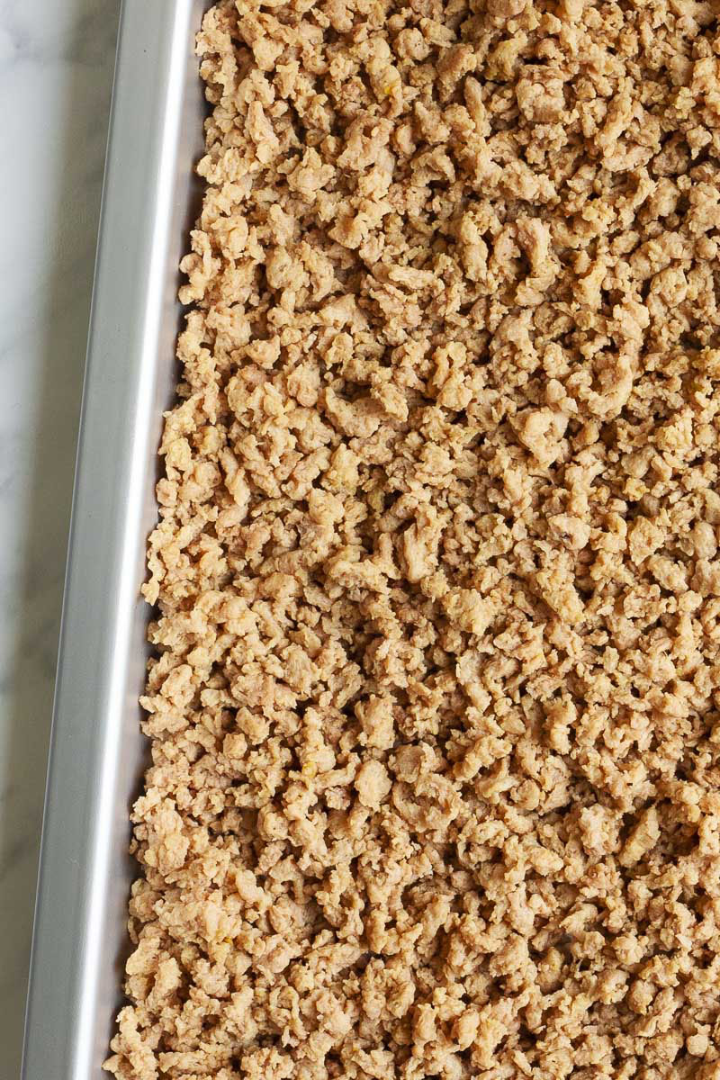TVP aka brown crumb-like mixture in a silver tray.