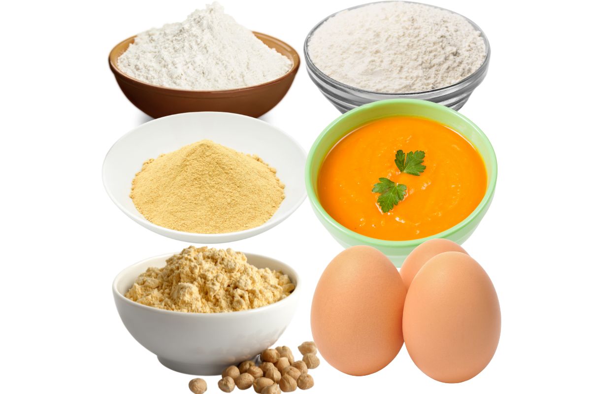 Substitutes of tapioca flour like white powders in small bowls, eggs, and veggie puree