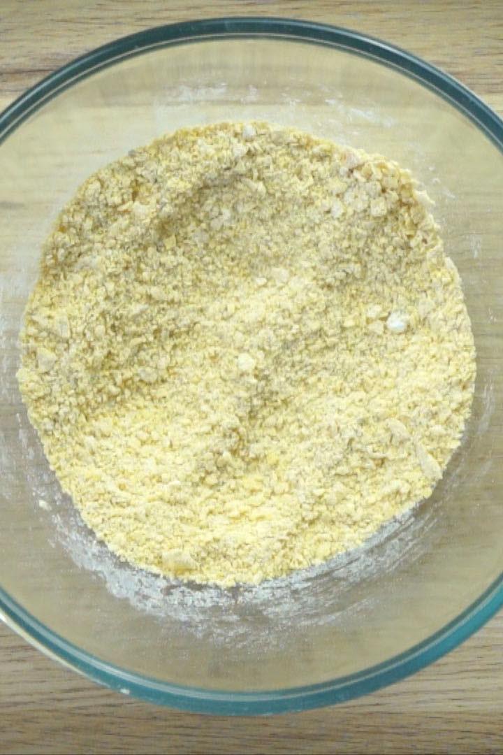 Glass bowl with yellow flour mix