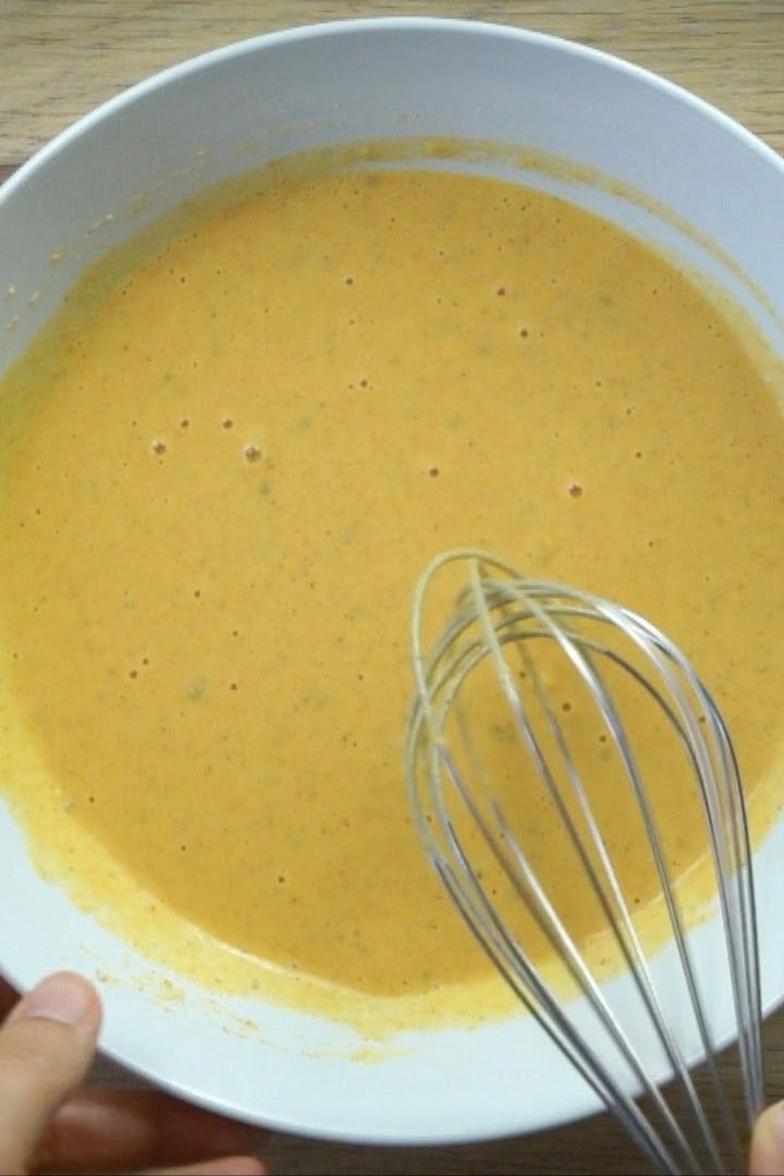 White bowl with yellow batter