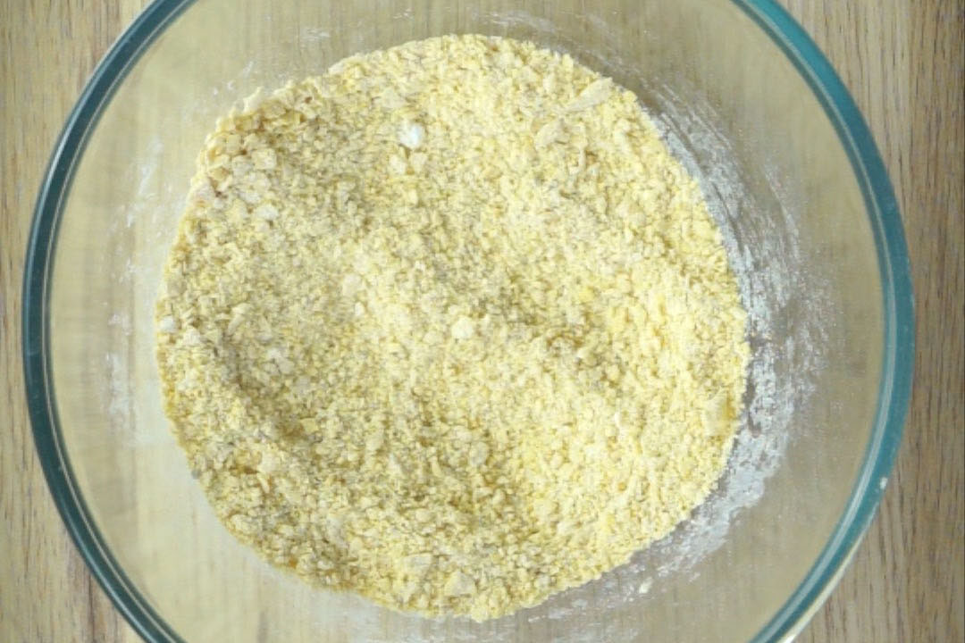 Glass bowl with yellow flour mix