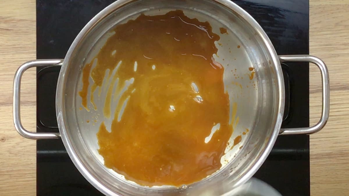 A large pot with brown caramel.
