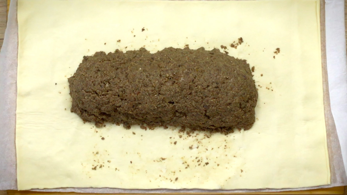 Yellow puff pasty with a an even larger heap of thick green paste in the middle.