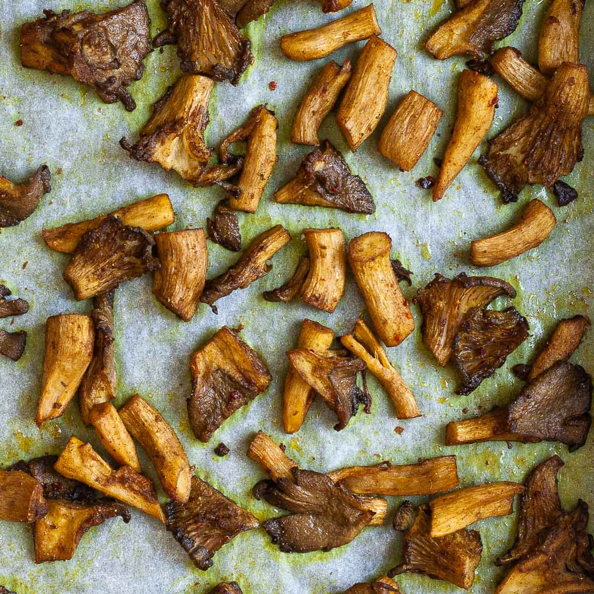 Brown mushroom shreds after baking with crispy edges.