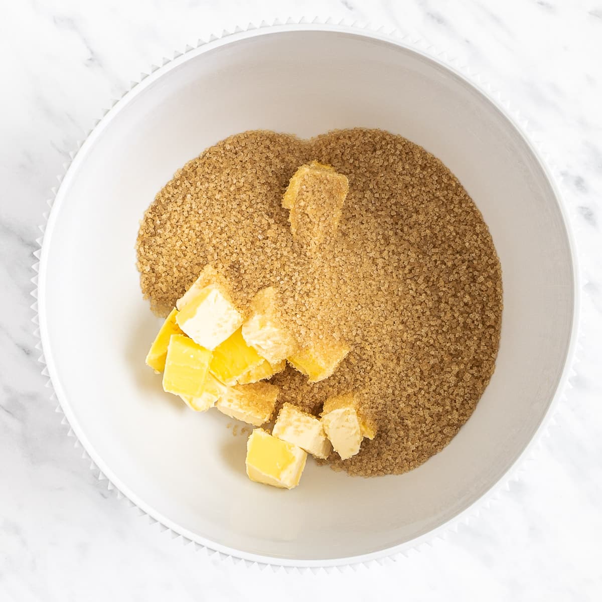 White bowl with can sugar and butter cubes