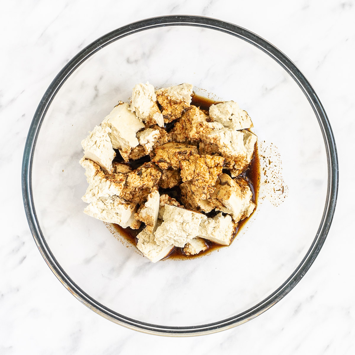 white tofu pieces in dark soy sauce