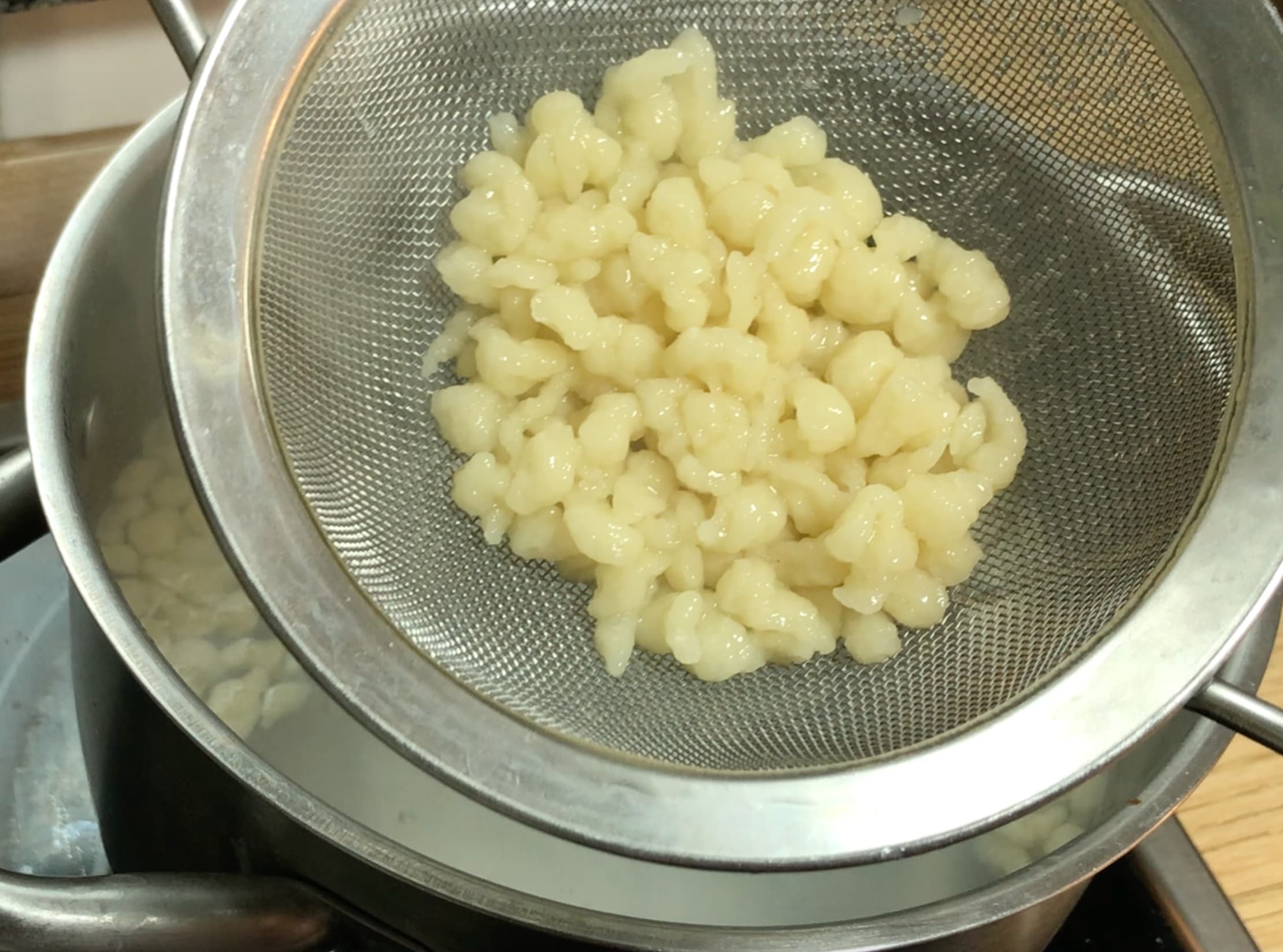 Small dumplings in a sieve.