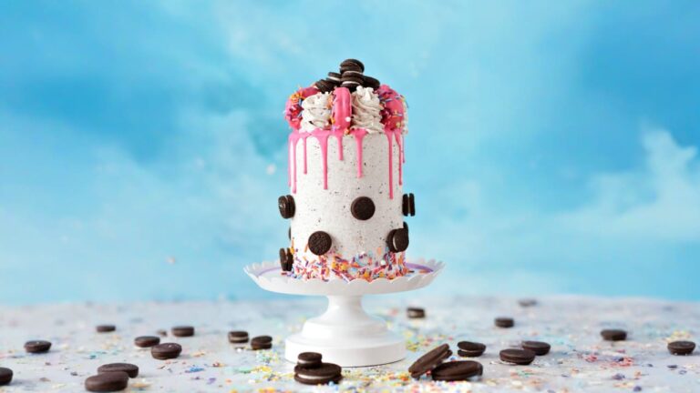 white and red cake with black and white icing on top