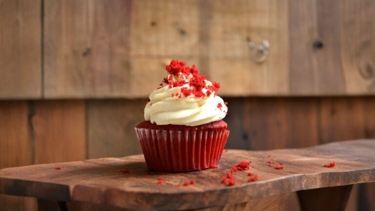 white and red cupcake with white icing on top